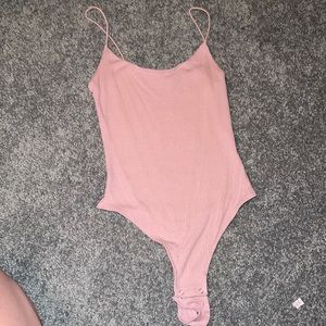 Garage baby pink body suit